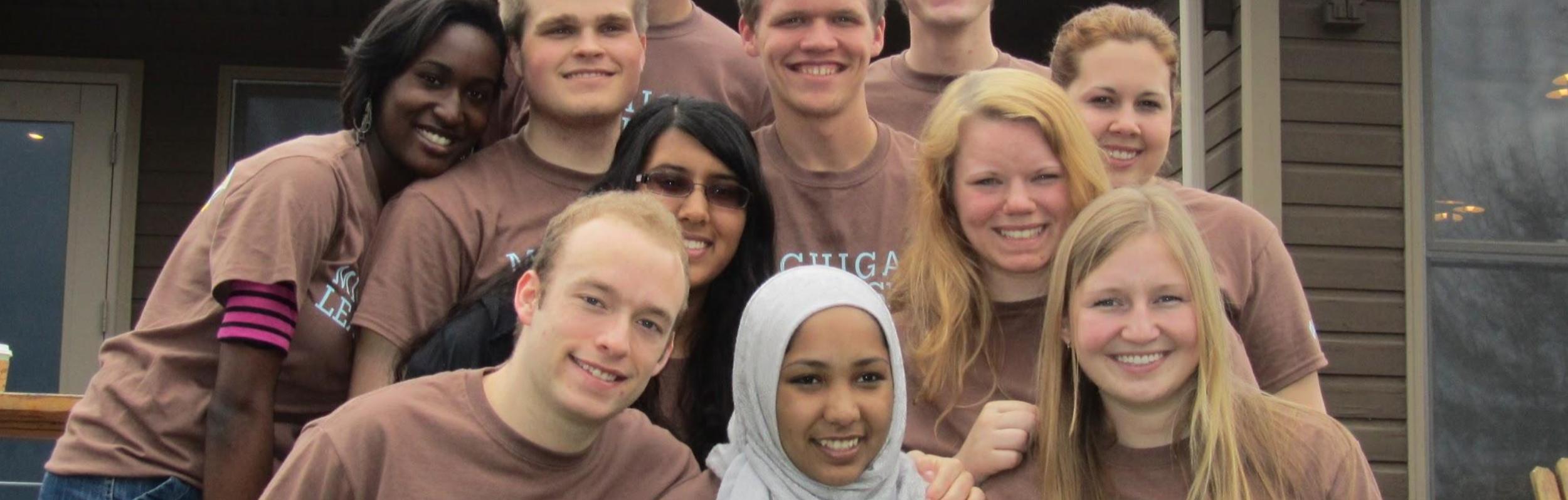 a group photo, all wearing "Michigan Leadership" T-Shirts
