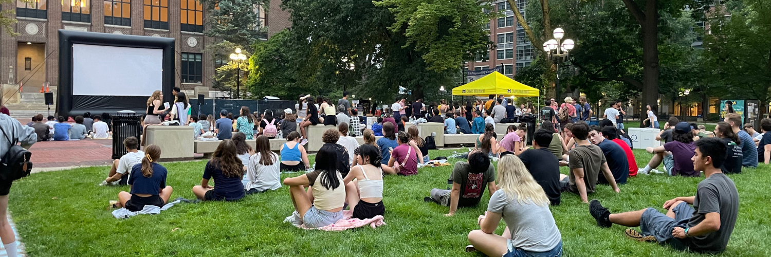 students watching a movie on the diag
