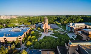 aerial view of the GROVE from the east angle, featuring the Lurie Bell Tower in the center of the image